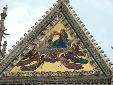 Siena - Duomo facade.The large central mosaic, the Coronation of the Virgin, is the work of Luigi Mussini
