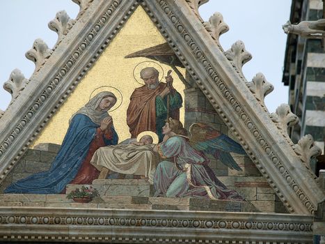 Siena - Duomo facade.The smaller mosaic, Nativity of Jesus by Alessandro Franchi.