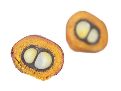 Cut palm oil fruit isolated in white