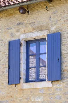 Window with blue shutters