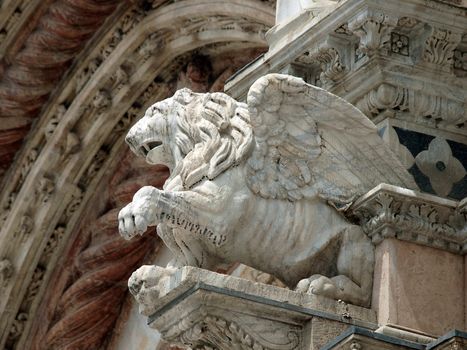 Architectural details of Duomo facade - Siena,Tuscany,Italy. The Duomo of Siena, which was built in the 12th and 13th centuries, is one of the prettiest churches in Gothic style in Italy