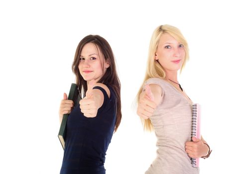 Two beautiful student girls showing thumbs up against white background