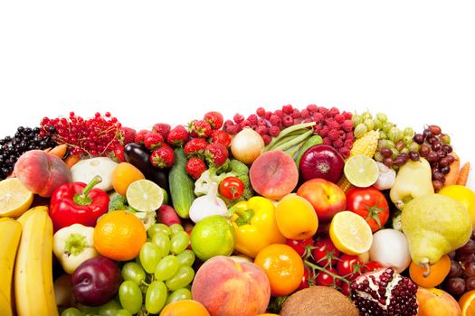 Huge group of fresh vegetables and fruits isolated on a white background. Shot in a studio