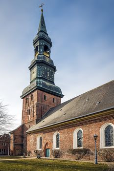 Red brick church on sunny days in spring in the village Tönning, Germany