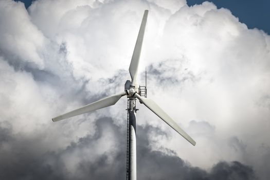 Detail of a windmill with storm clouds in background