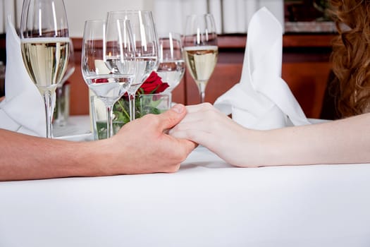 happy smiling couple in restaurant celebrate toast champagne dinner