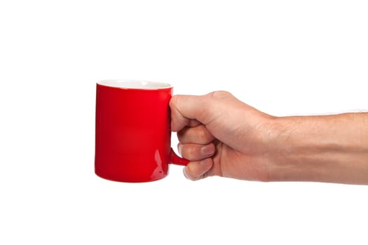 Male hand is holding a red cup isolated on a white background