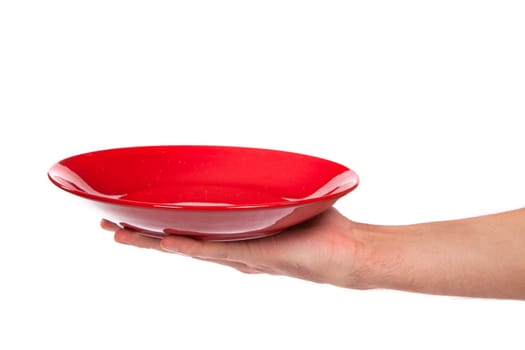 Red kitchen plate on a hand isolated on white background