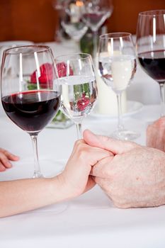 happy smiling couple in restaurant celebrate toast champagne dinner