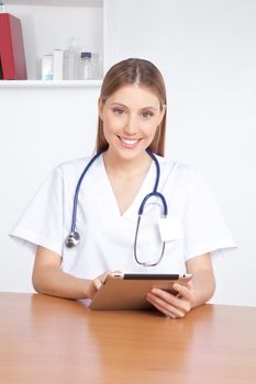 Medical professional using digital tablet.