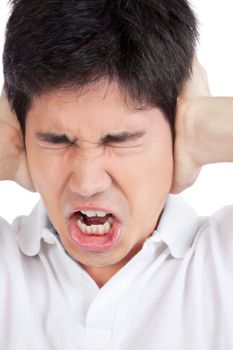 Young asian man yelling and covering ears .