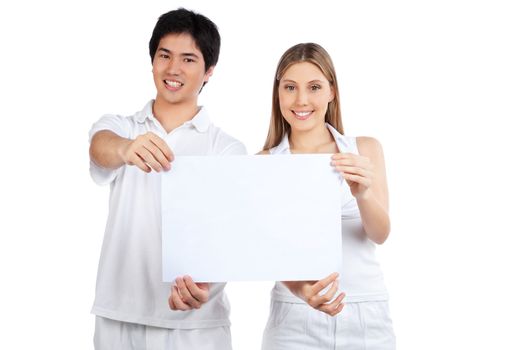 Portrait of young happy couple holding blank placard.