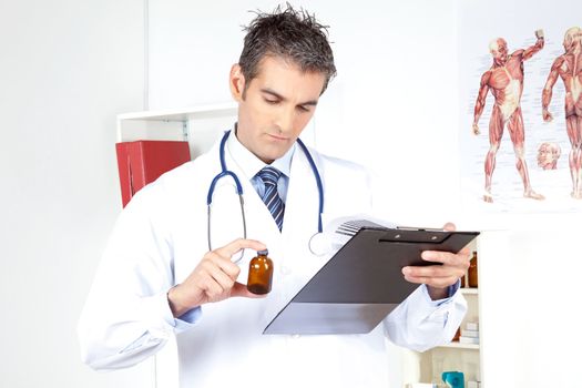 Doctor looking at clipboard holding a bottle.