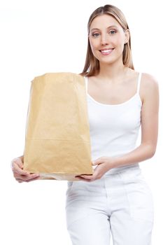 Young happy woman holding shopping paper bag.