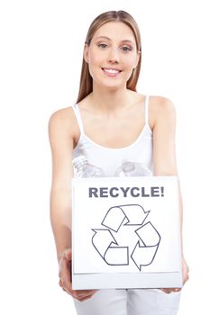 Young happy woman holding recycling waste box.