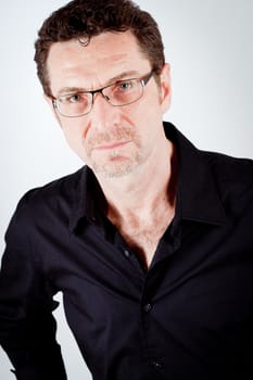 attractive adult man with glasses and black shirt portrait 