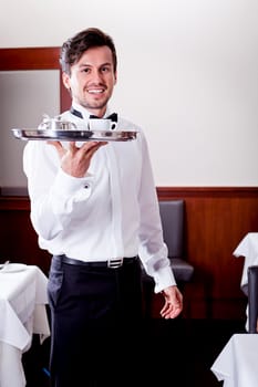waiter serve fresh espresso for happy couple in restaurant