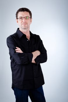 attractive adult man with glasses and black shirt portrait 