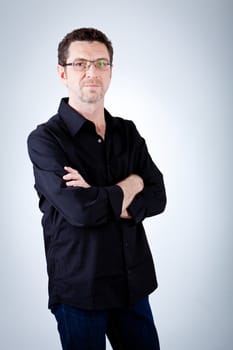 attractive adult man with glasses and black shirt portrait 