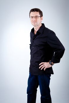 attractive adult man with glasses and black shirt portrait 