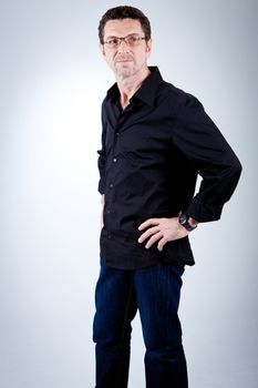 attractive adult man with glasses and black shirt portrait 