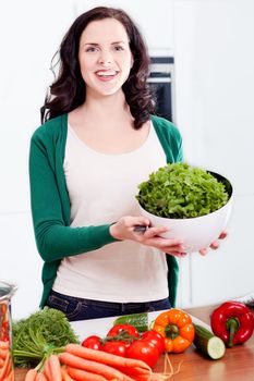 young woman cooking vegetarian food in kitchen