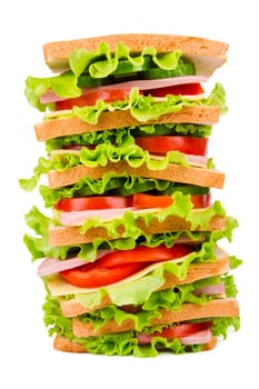 Sandwich with ham,cheese and fresh vegetables isolated on white background