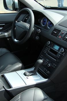 Dashboard and interior of a brand new car, leather and stainless steel