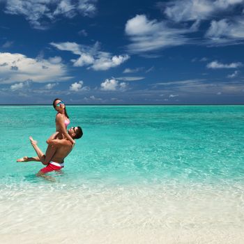 Couple on a tropical beach at Maldives