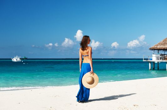 Woman in skirt at tropical beach