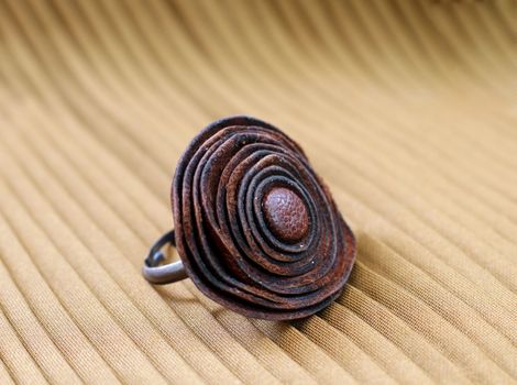 original leather handmade ring on yellow background