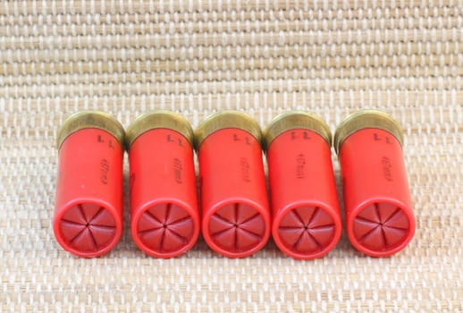 five red shotgun cartridges 11 