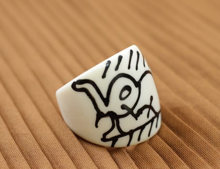original ivory ring handmade from India on yellow background