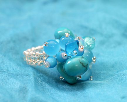 original handmade (glass) beads ring on blue