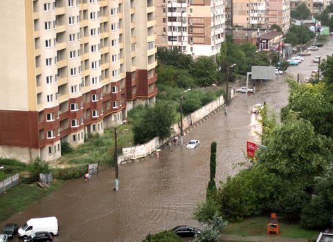 ODESSA, UKRAINE - July 16. Cars attempts to go along the steet through flood waters after a heavy rain on July 16, 2012 in Odessa