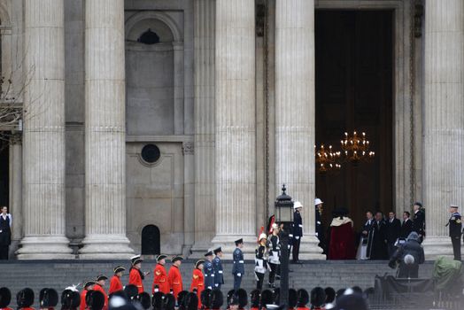 London, UK. April 17th, 2013. The Step Lining Party , comprising 18 Service personnel plus a contingent from the Royal Hospital Chelsea, lines the West Steps of St Paul's Cathedral for the arrival of the Coffin.