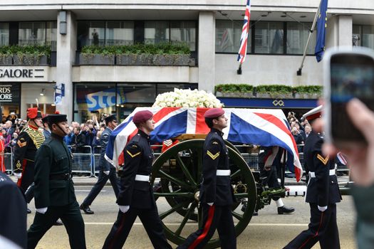 London, UK. April 17th, 2013. Baroness Thatcher's coffin is carried on a gun carriage on its way to St Paul's Cathedral.