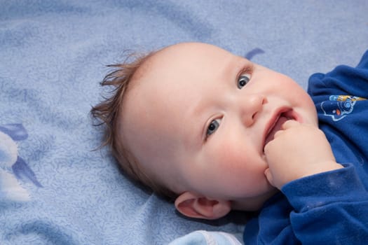 Closeup portrait of cute smiling baby boy