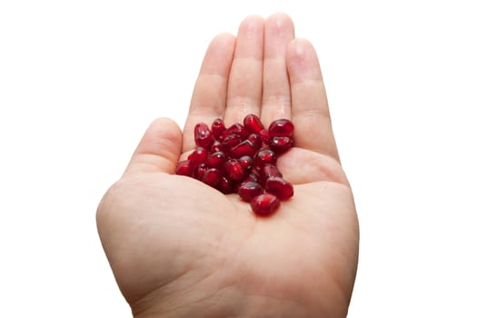 red pomegranate in his hand