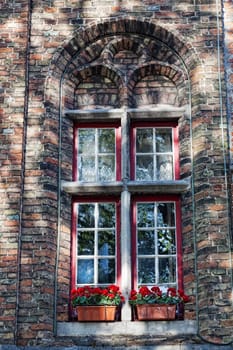 Window with a red frame in the old house