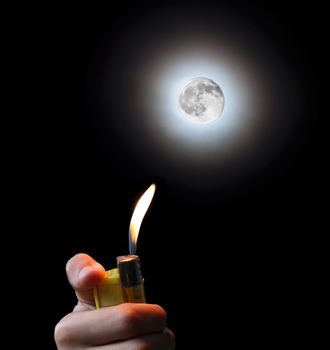 hand with a cigarette lighter and the moon