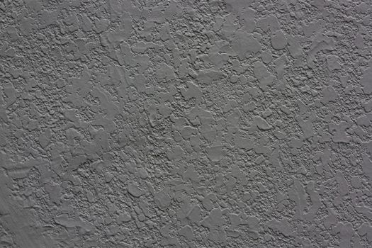 Black, gray cement wall surface is smooth.