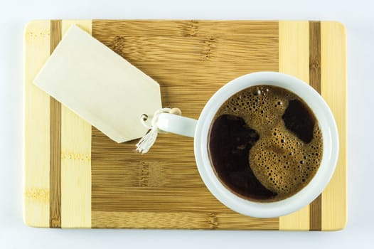 white cup of coffee on a table with room for text