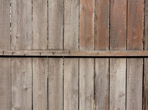 Close up of gray wooden fence panels 