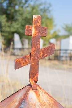 rusty cross on the cemetery