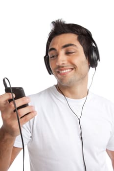 Portrait of young man listening music on smart cell phone isolated on white background.