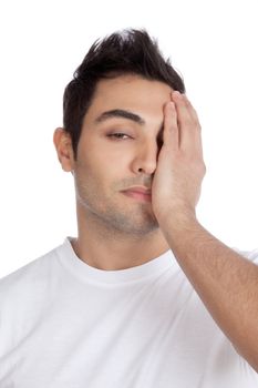 Young stressed man with hand on his face isolated on white background.