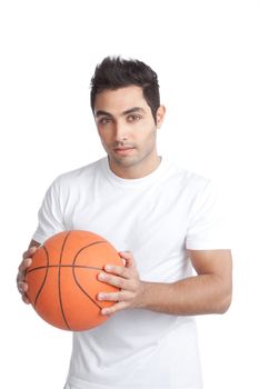 Portrait of young man holding basketball isolated on white background.