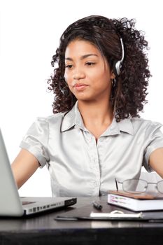 Businesswoman wearing a headset at work isolated on white background.