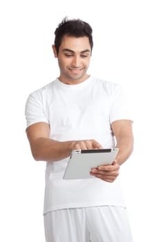 Portrait of young man using digital tablet isolated on white background.